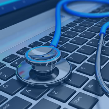 Closeup of stethoscope on computer keyboard