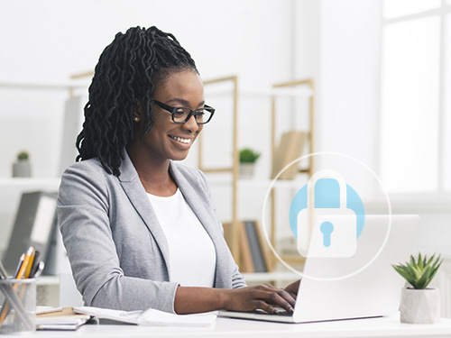 Business woman typing on her laptop