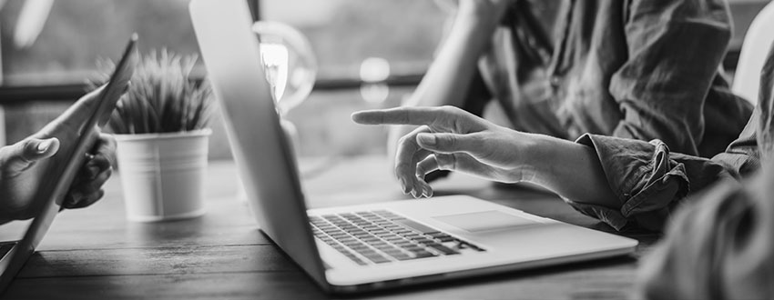 Person working on laptop to find secure file transfer