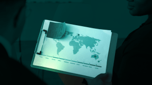 Scaling up MFT delivers growth and agility; illustrated with image of a world map on a screen