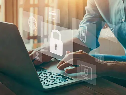 Closeup of person typing on laptop